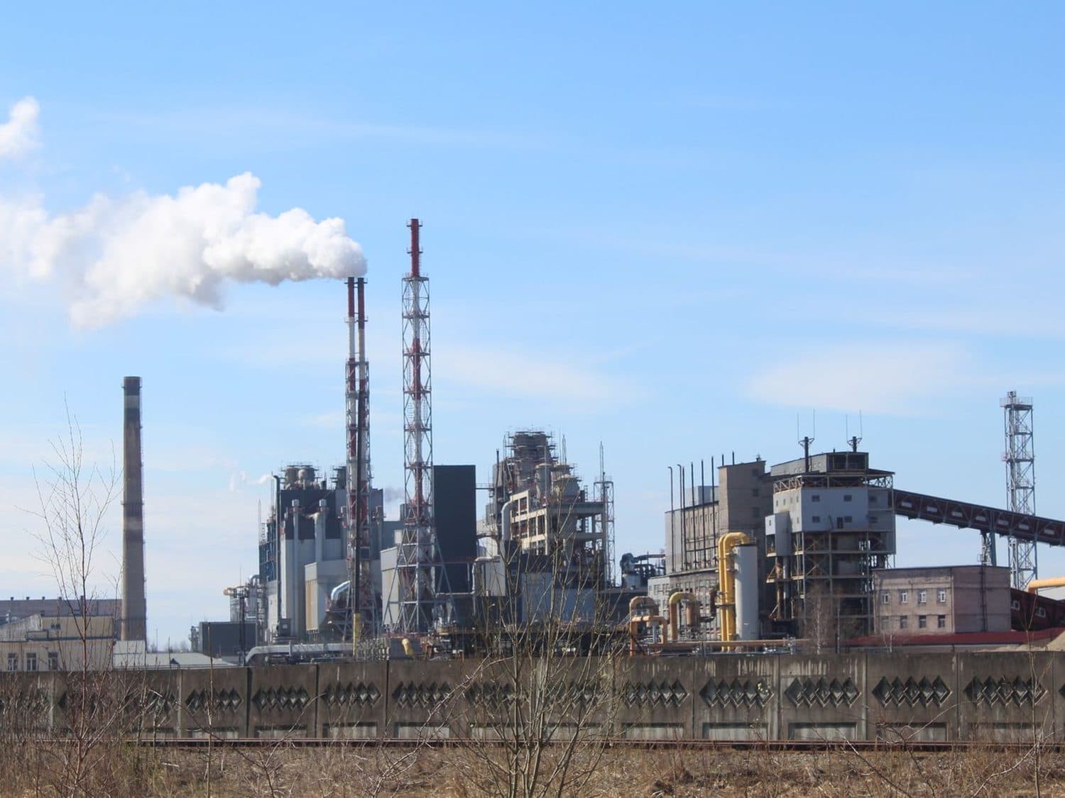 An industrial plant venting into an open sky